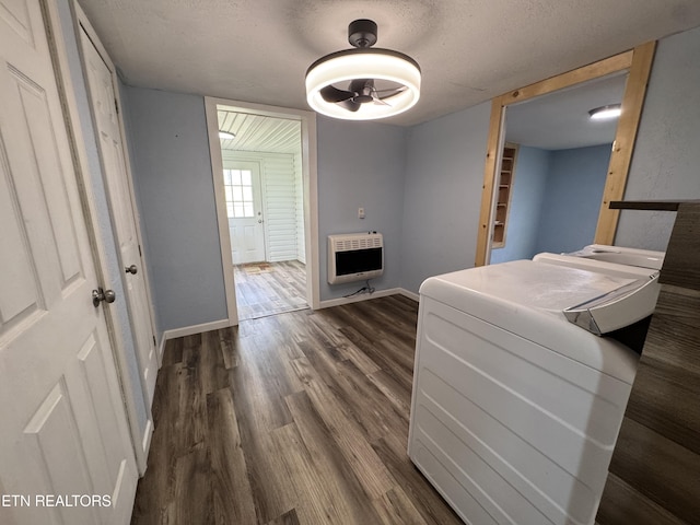 109 Henry Mayfield Rd, Tellico Plains, TN 37385 - interior space with heating unit, dark wood-style flooring, and a textured ceiling