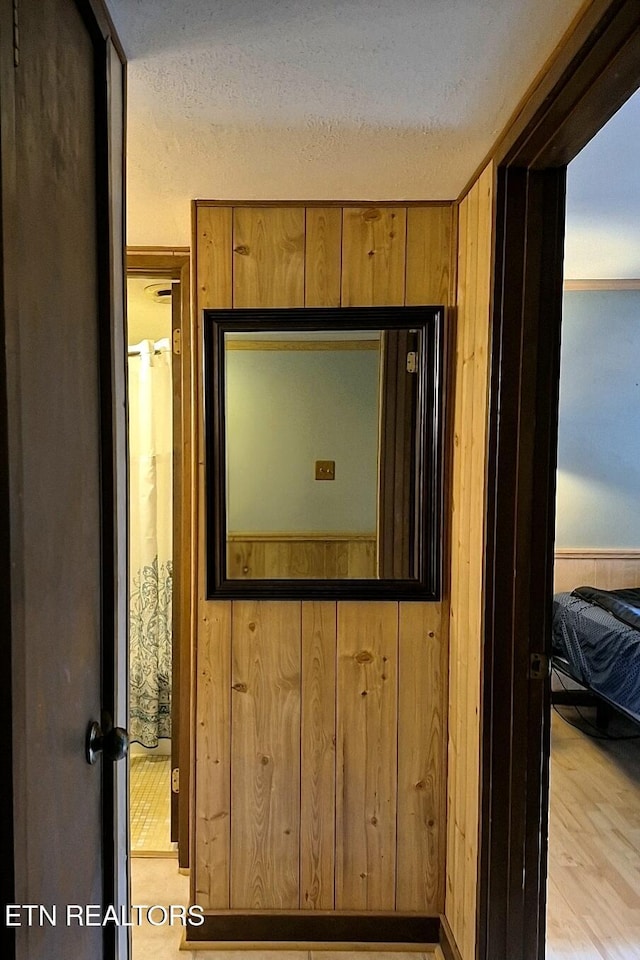 1081 Cove Rd Unit 623, Sevierville, TN 37876 - detailed view of wood walls, a textured ceiling, and wood finished floors