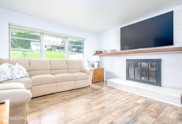 7908 Collier Rd, Powell, TN 37849 - living room with wood finished floors and a brick fireplace