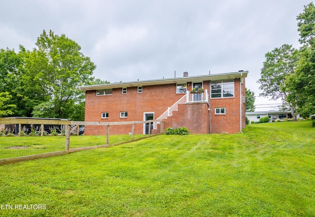 7908 Collier Rd, Powell, TN 37849 - rear view of house featuring a lawn and brick siding