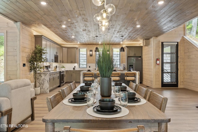 1646 Bear Valley Rd, Sevierville, TN 37876 - dining area featuring wooden walls, wood ceiling, light wood-style floors, recessed lighting, and a chandelier