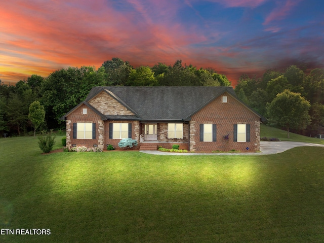 5484 Shadow Branch Ln, Corryton, TN 37721 - view of front of house with a porch, a lawn, brick siding, and crawl space