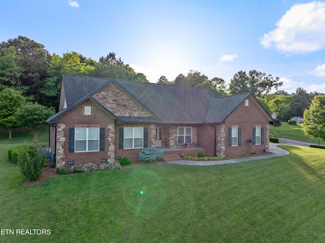 5484 Shadow Branch Ln, Corryton, TN 37721 - craftsman-style home with a front yard, brick siding, and a shingled roof