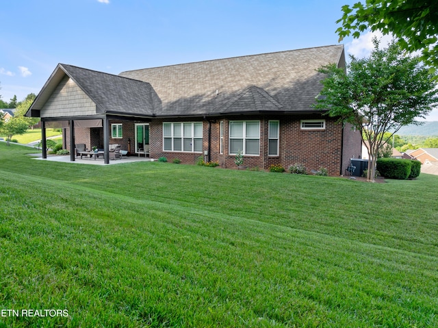 5484 Shadow Branch Ln, Corryton, TN 37721 - rear view of property with a patio area, brick siding, a yard, and a shingled roof
