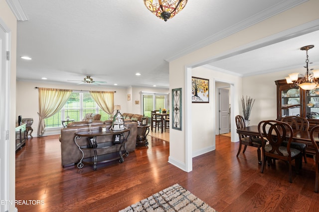 5484 Shadow Branch Ln, Corryton, TN 37721 - dining room with dark wood-type flooring, a chandelier, recessed lighting, a ceiling fan, and ornamental molding