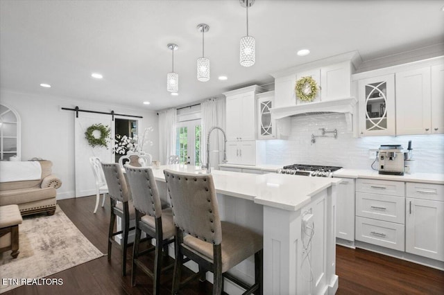 150 Scott Dr, Huntsville, TN 37756 - kitchen featuring light countertops, white cabinets, a barn door, a center island with sink, and recessed lighting