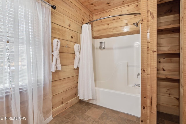 3206 Falling Leaf Way, Pigeon Forge, TN 37863 - bathroom with shower / bath combo with shower curtain, stone finish floors, and wooden walls