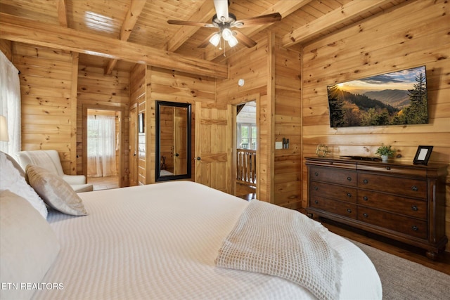 3206 Falling Leaf Way, Pigeon Forge, TN 37863 - bedroom with wooden walls, a wooden ceiling with exposed beams, multiple windows, and wood finished floors