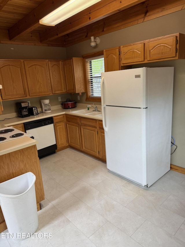 2006 Regans Ridge Way, Sevierville, TN 37876 - kitchen featuring white appliances, light countertops, a wooden ceiling with exposed beams, brown cabinets, and light tile patterned floors