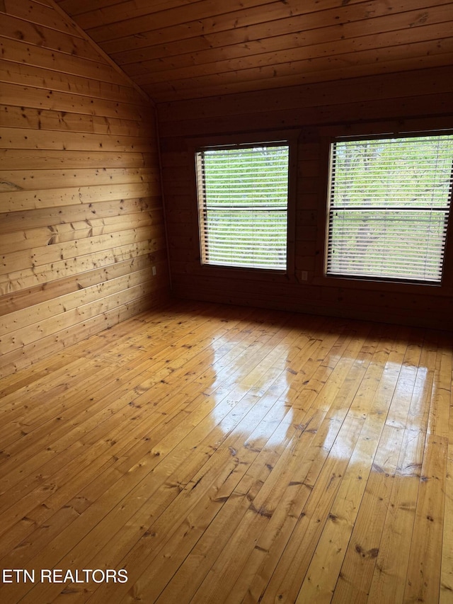 2006 Regans Ridge Way, Sevierville, TN 37876 - empty room featuring lofted ceiling, light wood-style floors, wooden ceiling, and wooden walls
