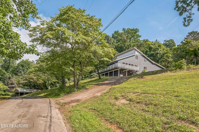 769 Gilmore Rd, Bean Station, TN 37708 - view of front facade featuring a front yard, a wooden deck, and driveway