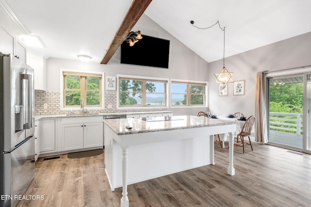 769 Gilmore Rd, Bean Station, TN 37708 - kitchen featuring stainless steel fridge, tasteful backsplash, white cabinetry, light stone counters, and light wood-type flooring