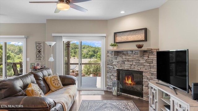 214 Unutsi Trl, Vonore, TN 37885 - living area with a ceiling fan, wood finished floors, healthy amount of natural light, and a fireplace