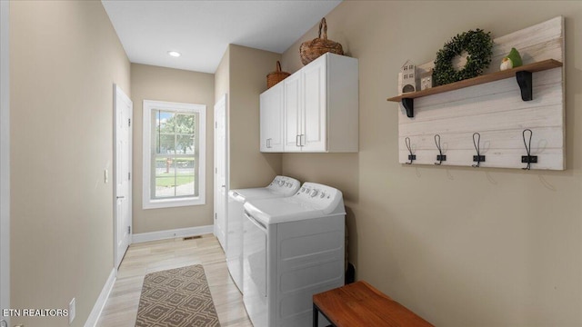 214 Unutsi Trl, Vonore, TN 37885 - washroom with washing machine and dryer, cabinet space, light wood-style floors, and recessed lighting