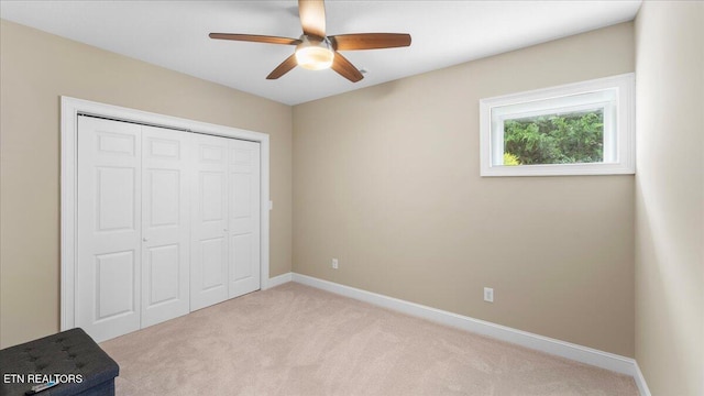 214 Unutsi Trl, Vonore, TN 37885 - unfurnished bedroom featuring light colored carpet, a closet, and a ceiling fan
