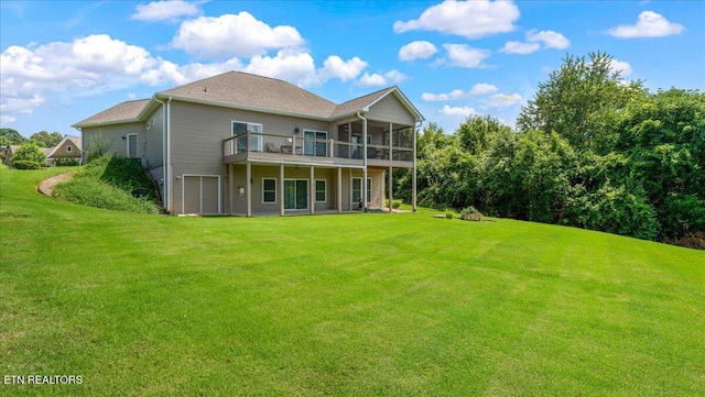 214 Unutsi Trl, Vonore, TN 37885 - rear view of property featuring a lawn, a wooden deck, and a sunroom