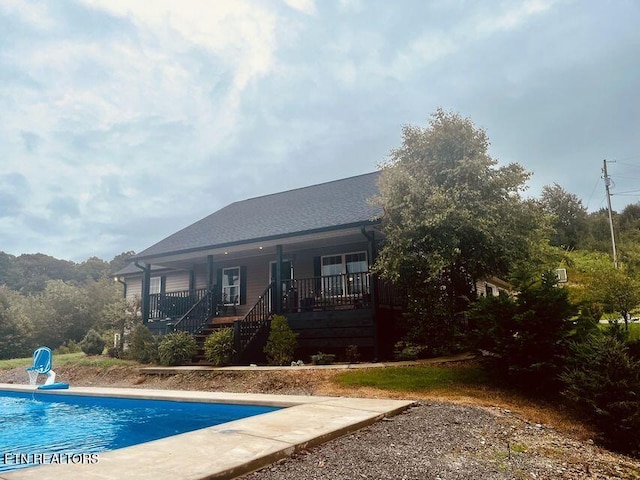 331 Hardin Rd, Dunlap, TN 37327 - back of property with an outdoor pool, covered porch, and stairway