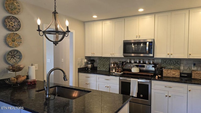 331 Hardin Rd, Dunlap, TN 37327 - kitchen featuring appliances with stainless steel finishes, backsplash, recessed lighting, and white cabinets