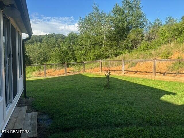 331 Hardin Rd, Dunlap, TN 37327 - fenced backyard featuring a forest view
