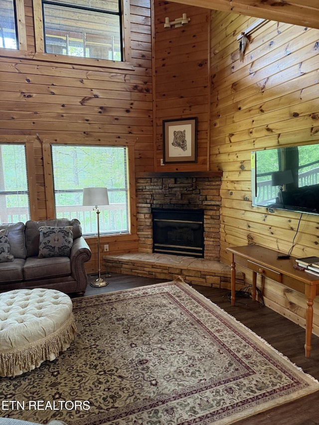 1960 Regans Ridge Way, Sevierville, TN 37876 - living area with wood finished floors, wooden walls, a fireplace, and a towering ceiling