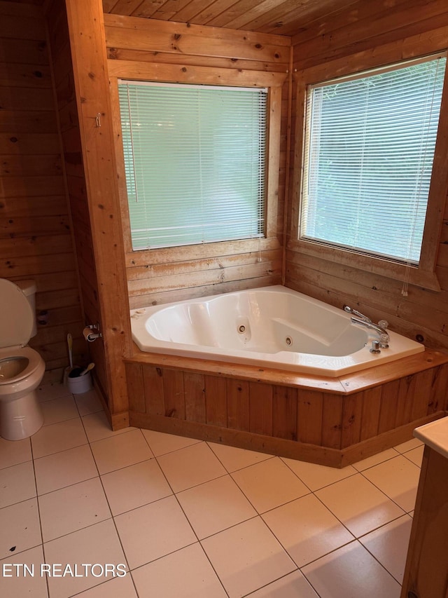 1960 Regans Ridge Way, Sevierville, TN 37876 - bathroom with a jetted tub, wooden walls, tile patterned flooring, and vanity