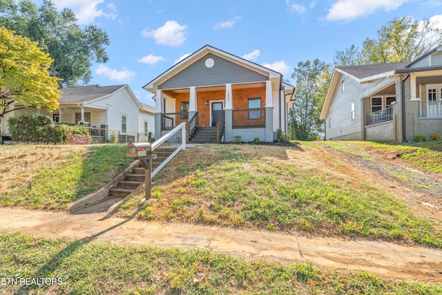 2824 Linden Ave, Knoxville, TN 37914 - view of front facade with covered porch, brick siding, and stairs