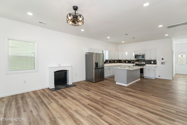 2824 Linden Ave, Knoxville, TN 37914 - kitchen with appliances with stainless steel finishes, light countertops, light wood-style floors, open floor plan, and recessed lighting