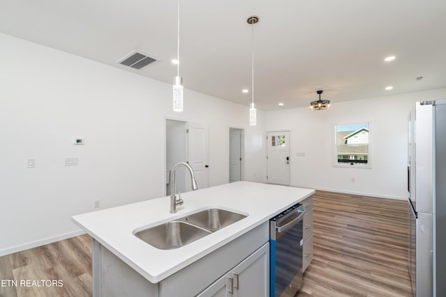 2824 Linden Ave, Knoxville, TN 37914 - kitchen featuring stainless steel dishwasher, light wood-style flooring, recessed lighting, decorative light fixtures, and light countertops