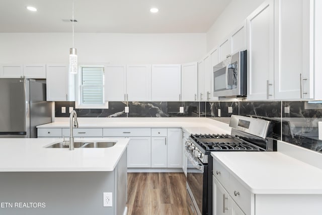 2824 Linden Ave, Knoxville, TN 37914 - kitchen with appliances with stainless steel finishes, light countertops, backsplash, decorative light fixtures, and recessed lighting