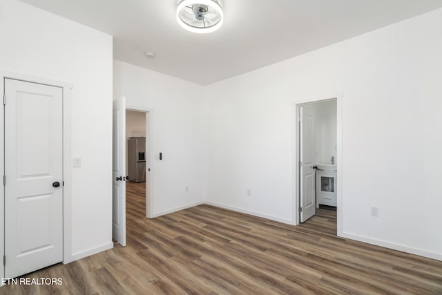 2824 Linden Ave, Knoxville, TN 37914 - unfurnished bedroom with wood finished floors, stainless steel refrigerator with ice dispenser, and ensuite bathroom