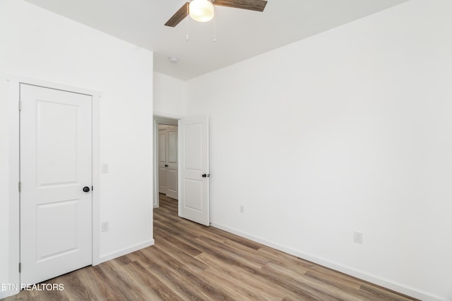2824 Linden Ave, Knoxville, TN 37914 - unfurnished bedroom featuring wood finished floors and ceiling fan