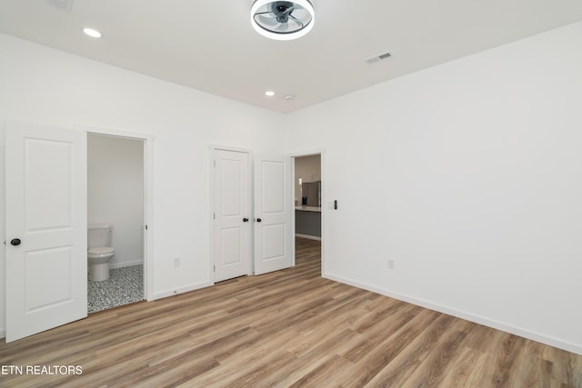 2824 Linden Ave, Knoxville, TN 37914 - unfurnished bedroom featuring light wood finished floors, connected bathroom, recessed lighting, and a closet