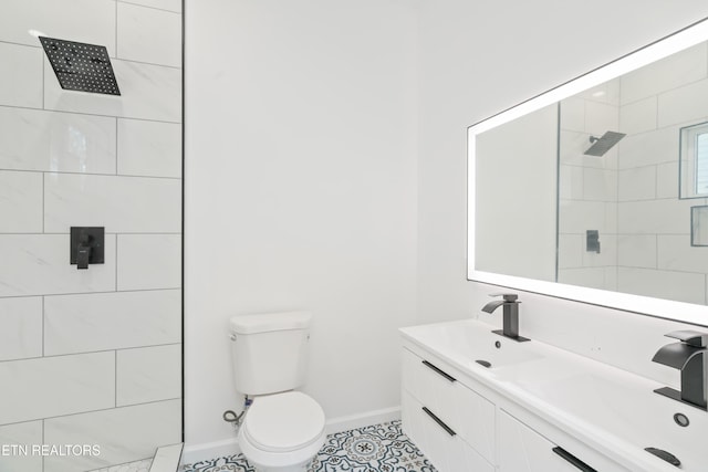 2824 Linden Ave, Knoxville, TN 37914 - full bathroom featuring a tile shower, double vanity, and tile patterned floors