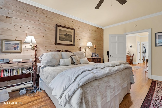 453 Mount John Loop, Townsend, TN 37882 - bedroom featuring wood walls, light wood-type flooring, crown molding, and ceiling fan