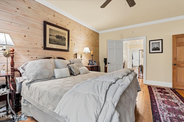 453 Mount John Loop, Townsend, TN 37882 - bedroom featuring crown molding, wood walls, light wood finished floors, and ceiling fan