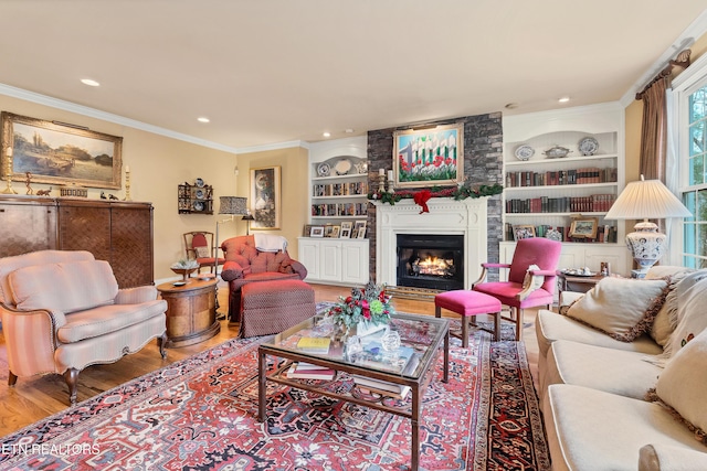 453 Mount John Loop, Townsend, TN 37882 - living room featuring wood finished floors, a large fireplace, ornamental molding, built in features, and recessed lighting