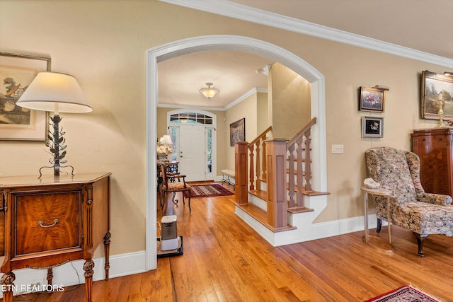 453 Mount John Loop, Townsend, TN 37882 - foyer featuring arched walkways, ornamental molding, stairway, and light wood-style flooring