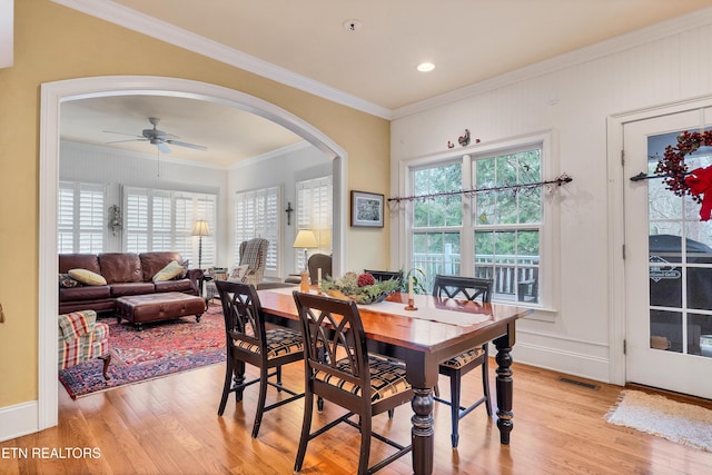 453 Mount John Loop, Townsend, TN 37882 - dining area featuring light wood-type flooring, ceiling fan, ornamental molding, and arched walkways