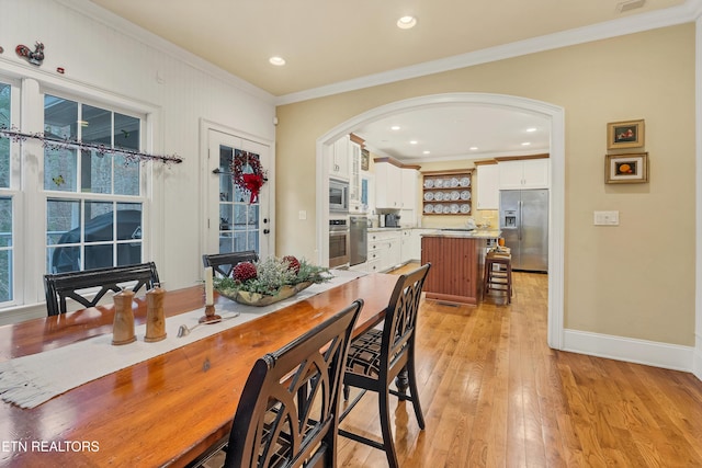 453 Mount John Loop, Townsend, TN 37882 - dining area featuring arched walkways, crown molding, light wood-style floors, and recessed lighting
