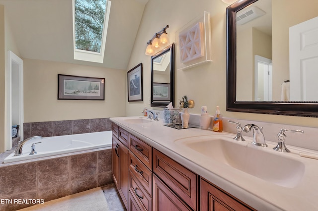 453 Mount John Loop, Townsend, TN 37882 - bathroom featuring double vanity, a bath, a skylight, vaulted ceiling, and tile patterned floors