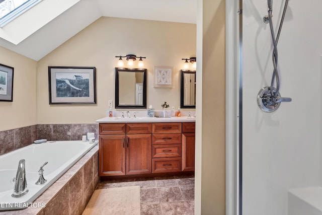 453 Mount John Loop, Townsend, TN 37882 - bathroom featuring double vanity, a bath, a skylight, and vaulted ceiling