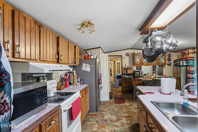 205 County Road 652, Athens, TN 37303 - kitchen with stainless steel appliances, extractor fan, a textured ceiling, brown cabinets, and light countertops