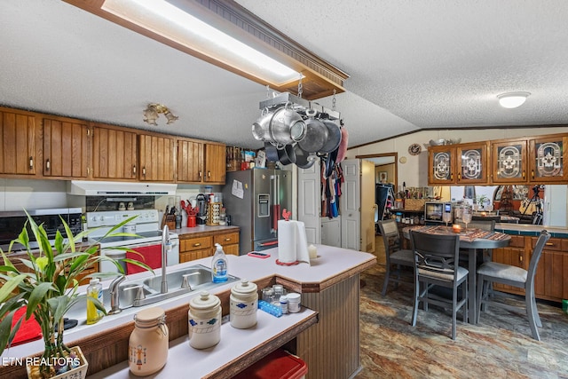 205 County Road 652, Athens, TN 37303 - kitchen with stainless steel appliances, brown cabinetry, extractor fan, lofted ceiling, and a textured ceiling