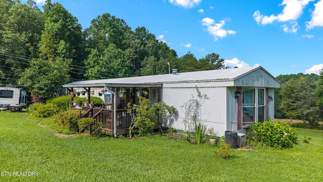 205 County Road 652, Athens, TN 37303 - view of home's exterior featuring a lawn and a deck