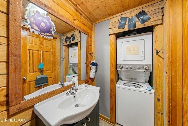 664 Kings Hills Blvd, Pigeon Forge, TN 37863 - laundry room featuring estacked washer and dryer and wooden ceiling
