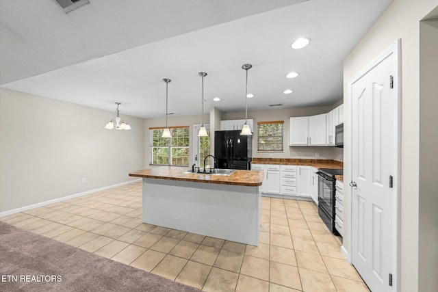 311 Meriwether Way, Pigeon Forge, TN 37863 - kitchen featuring black appliances, recessed lighting, white cabinets, light tile patterned floors, and a chandelier