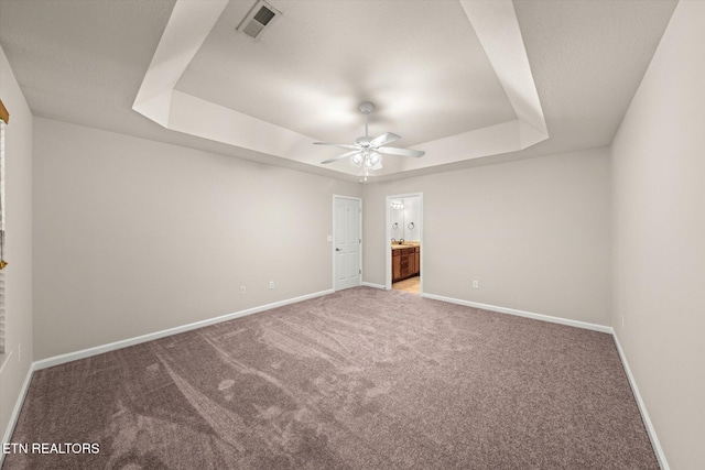 311 Meriwether Way, Pigeon Forge, TN 37863 - unfurnished bedroom with a raised ceiling, carpet flooring, connected bathroom, and ceiling fan