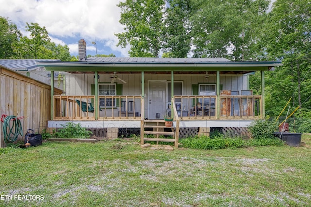 5271 Vardy Blackwater Rd, Sneedville, TN 37869 - view of front facade featuring covered porch, a front lawn, and a chimney