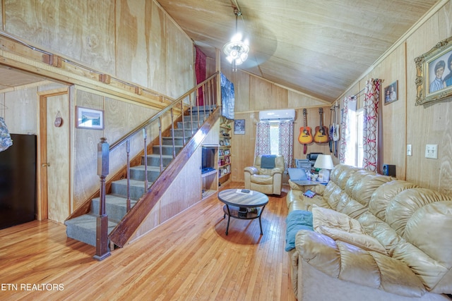 5271 Vardy Blackwater Rd, Sneedville, TN 37869 - living area with a wall mounted AC, wood walls, hardwood / wood-style flooring, a ceiling fan, and lofted ceiling