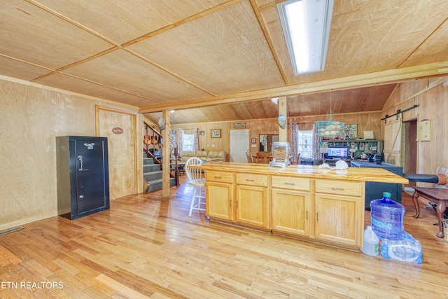 5271 Vardy Blackwater Rd, Sneedville, TN 37869 - kitchen featuring light wood-style floors, wood counters, wood ceiling, wood walls, and light brown cabinetry